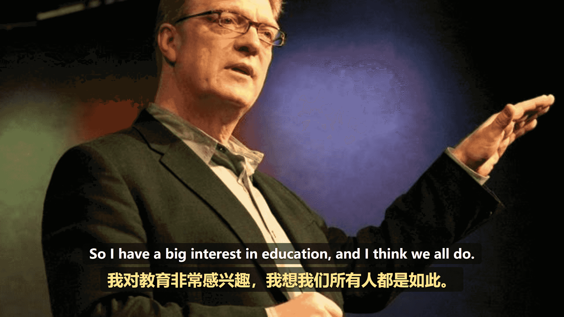 A talk playing on YouTube with bilingual subtitles centered near the bottom: the English line above and the Chinese translation below, shown as one tidy overlay.